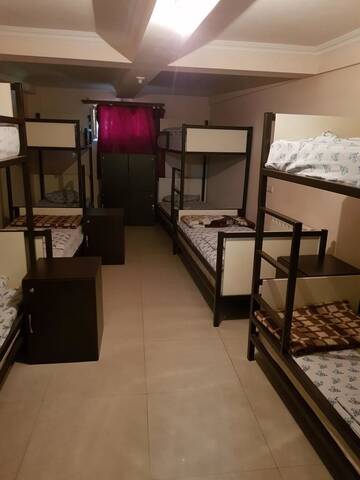 Односпальная кровать в общем номере с 10 кроватями в Отеле RP Hotel